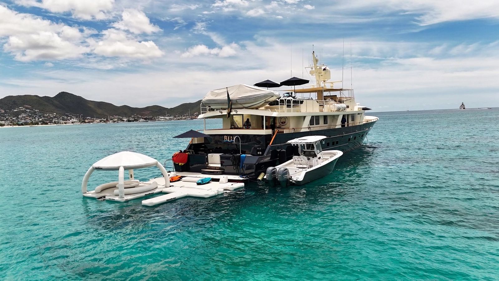 Yacht BLU at anchor with its water slide and floating platform