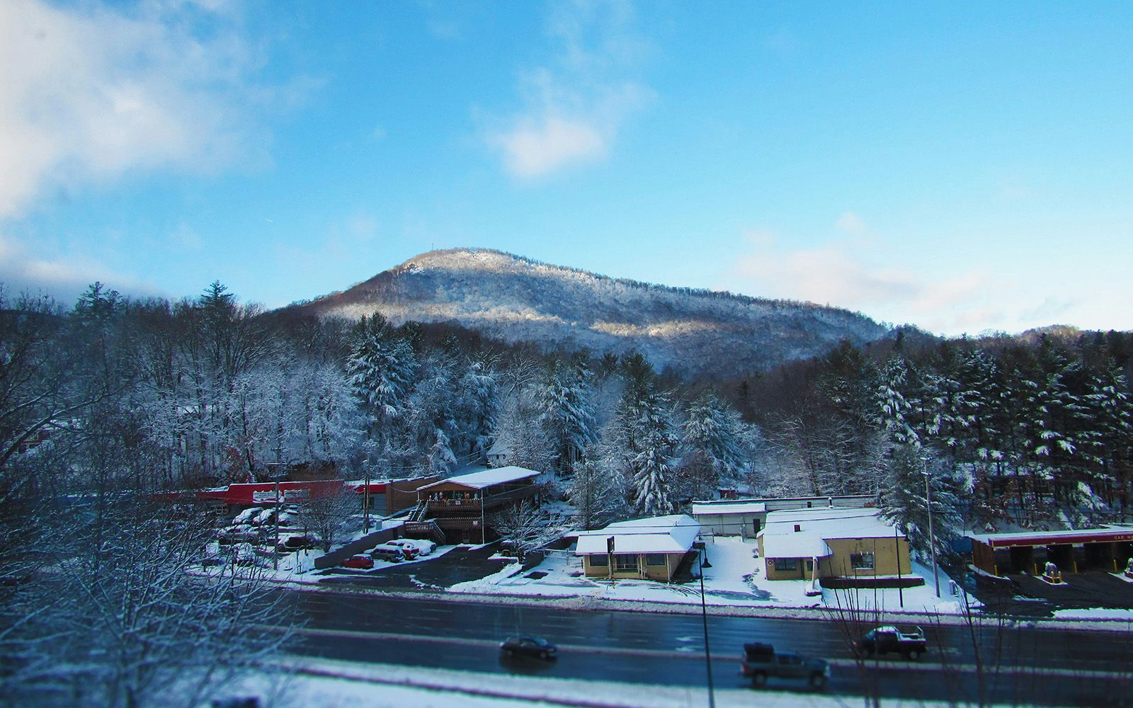 Snow-covered mountain above town in winter