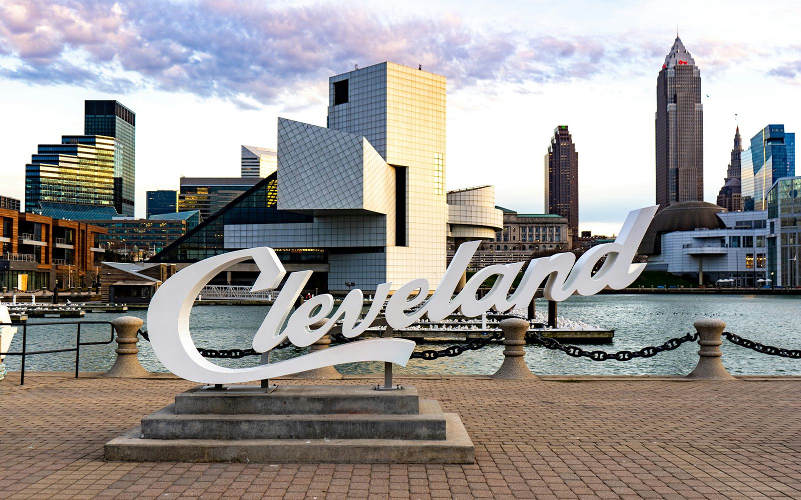 Cleveland script sign with the Rock & Roll Hall of Fame and downtown skyline
