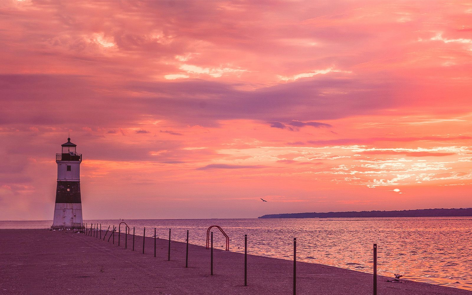 Lighthouse on a Lake Erie pier at sunset