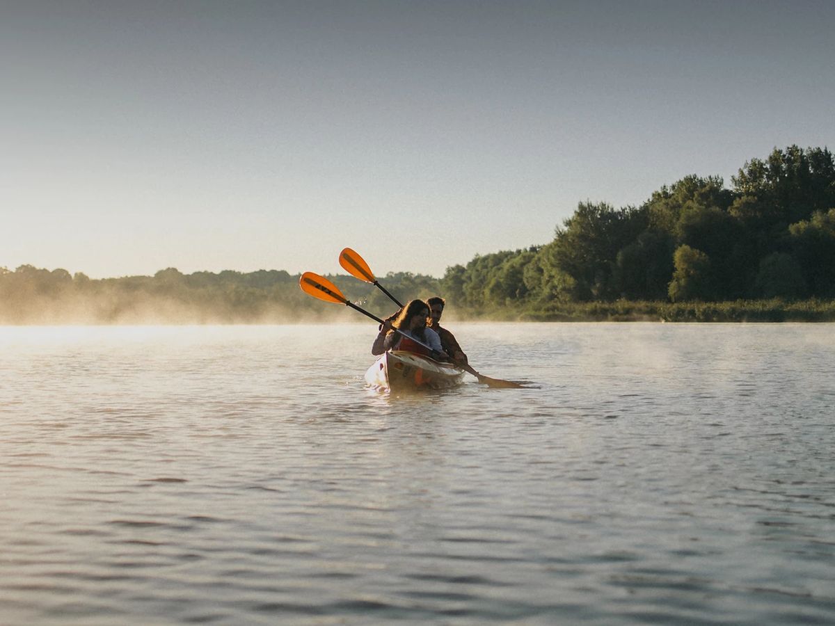 Guests kayaking on the Severn River at sunrise