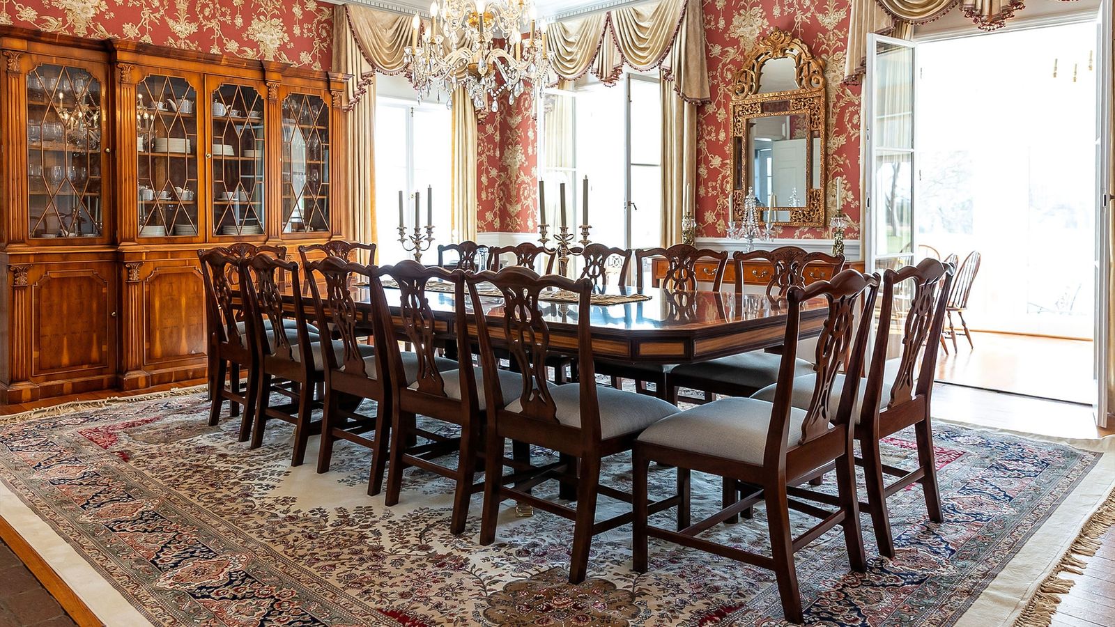 Formal dining room with crystal chandelier and antique china cabinet