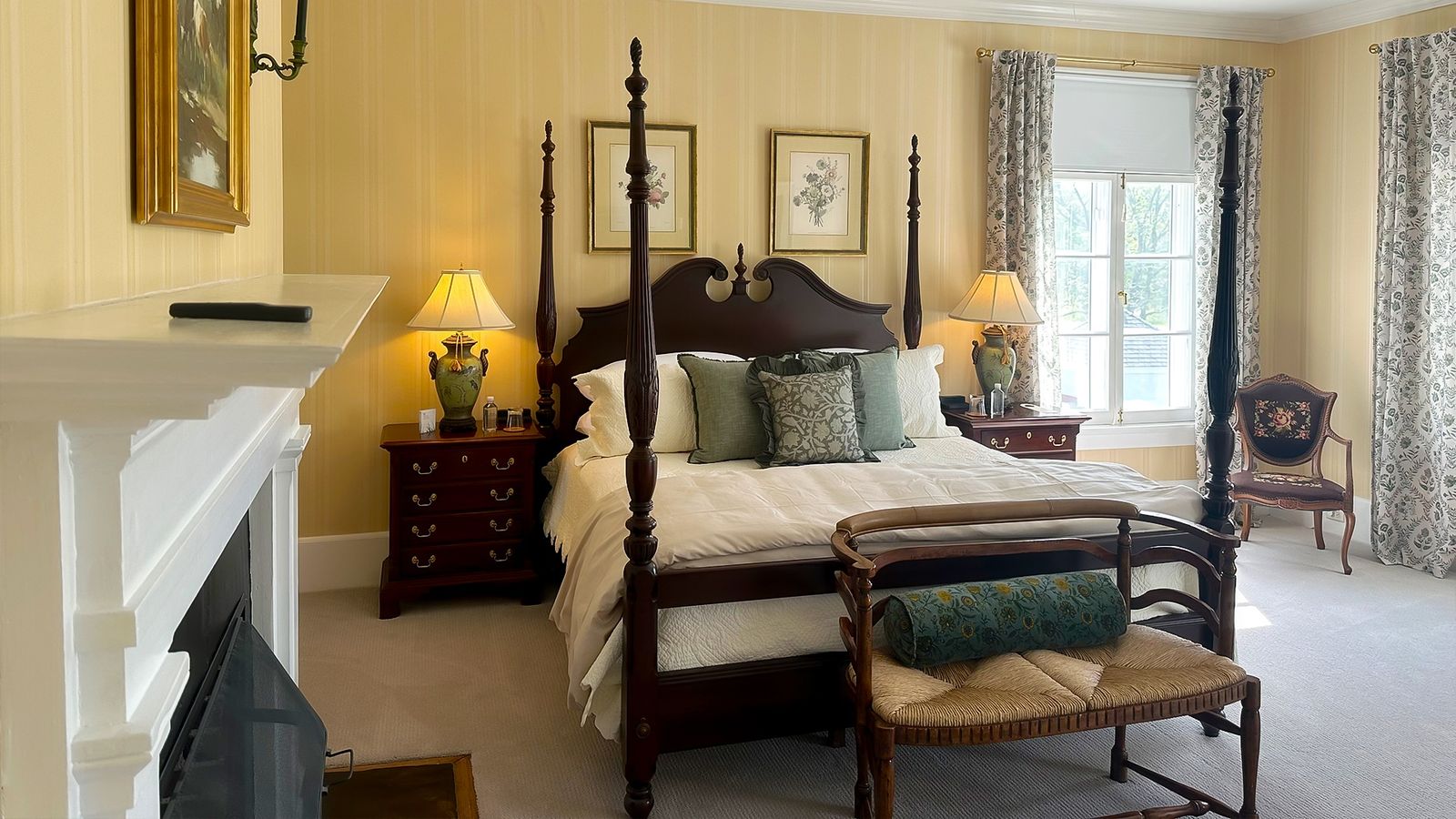 Guest room with four-poster bed and fireplace